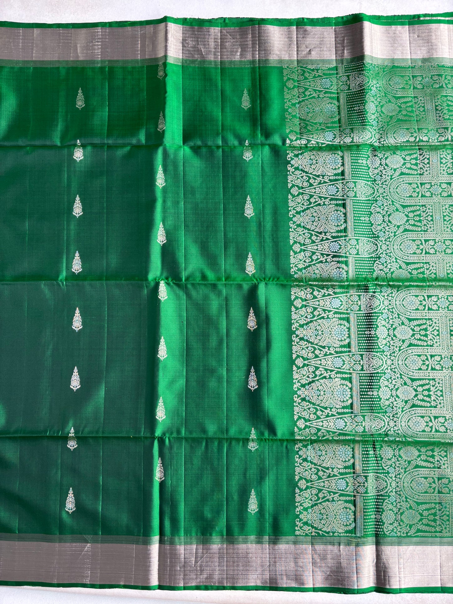Emerald Green Silk Saree with Floral Buttas and Grand Zari Pallu