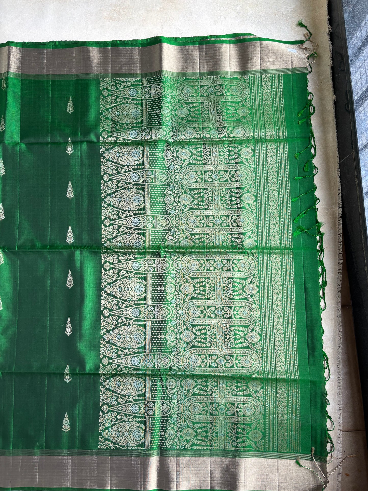 Emerald Green Silk Saree with Floral Buttas and Grand Zari Pallu