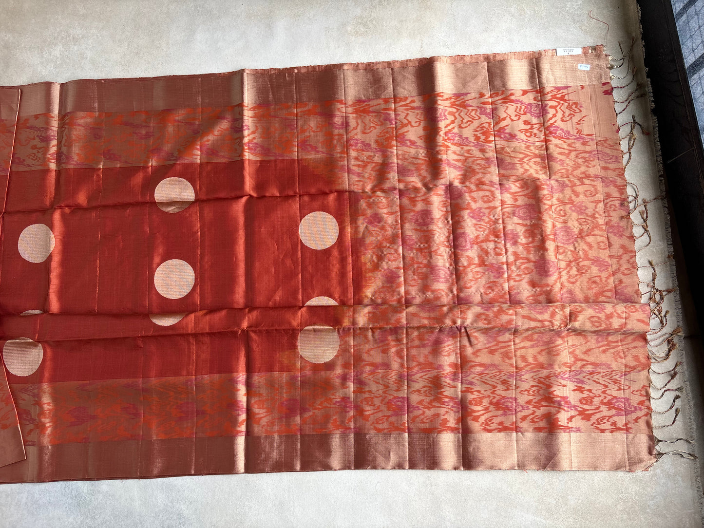 Rust Orange Silk Saree with Ikat-Inspired Weave and Statement Polka Motif
